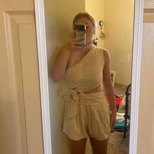 Free people romper worn once. Size 4. Super cute cream color with little color.